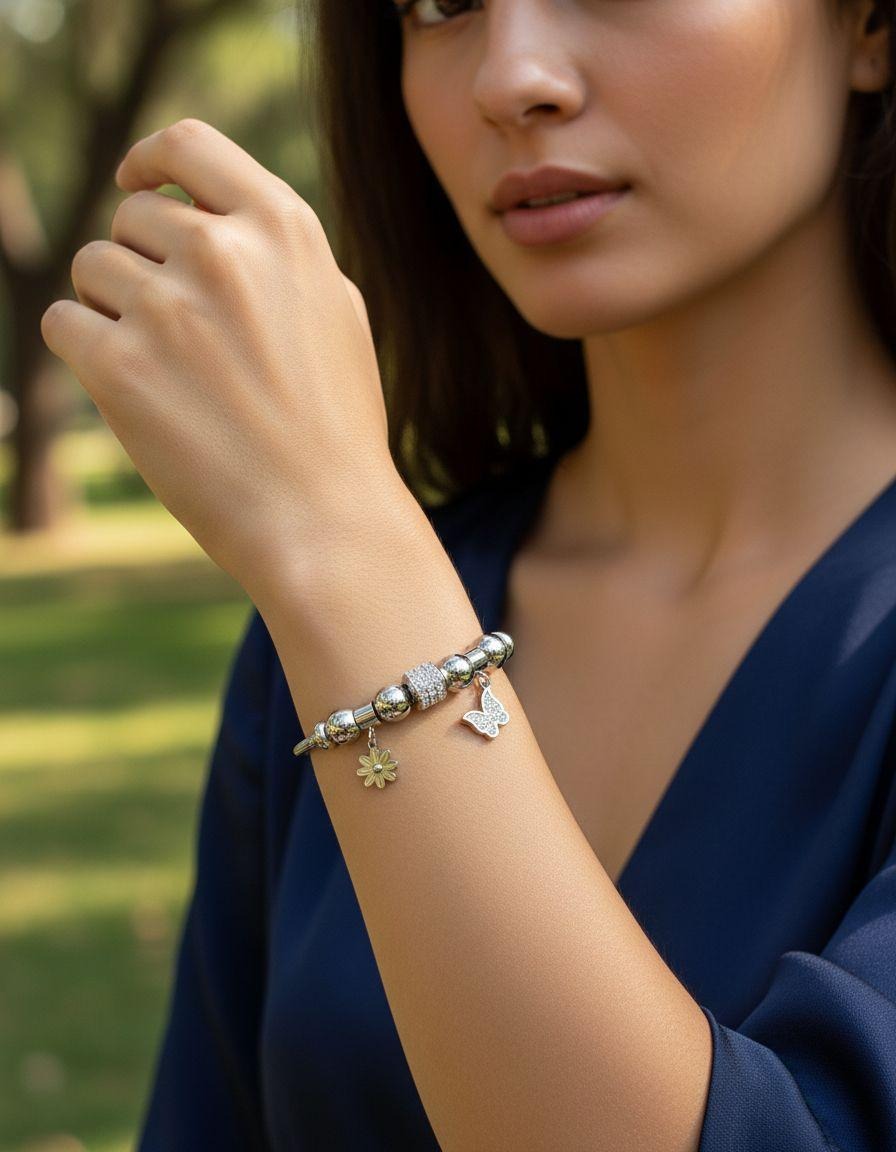 BRACELET EN ACIER AVEC PAPILLON ET FLEUR AVEC STRASS