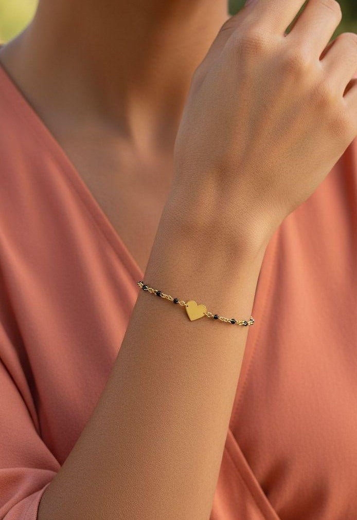 BRACELET EN ACIER BILLES NOIRES ET COEUR