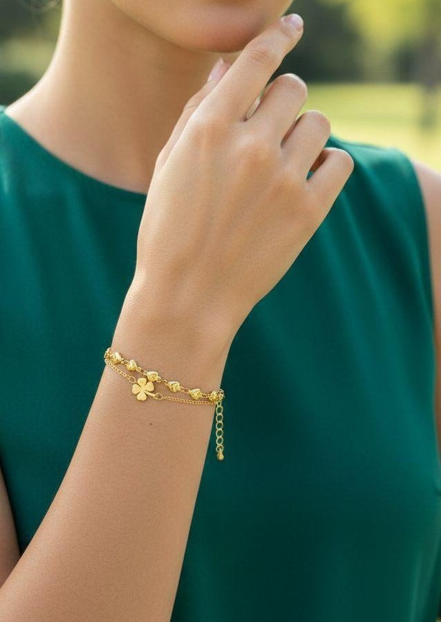 BRACELET EN ACIER DORE MULTI COEURS ET TREFLE