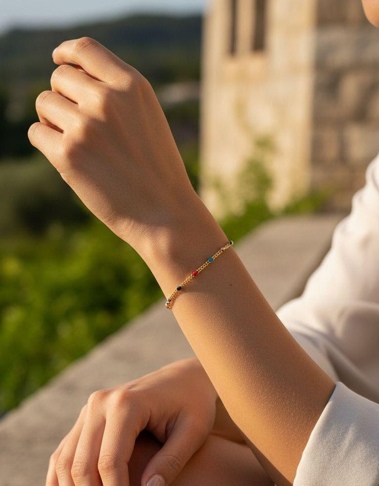 BRACELET EN ACIER DORE AVEC BILLES MULTICOLOR