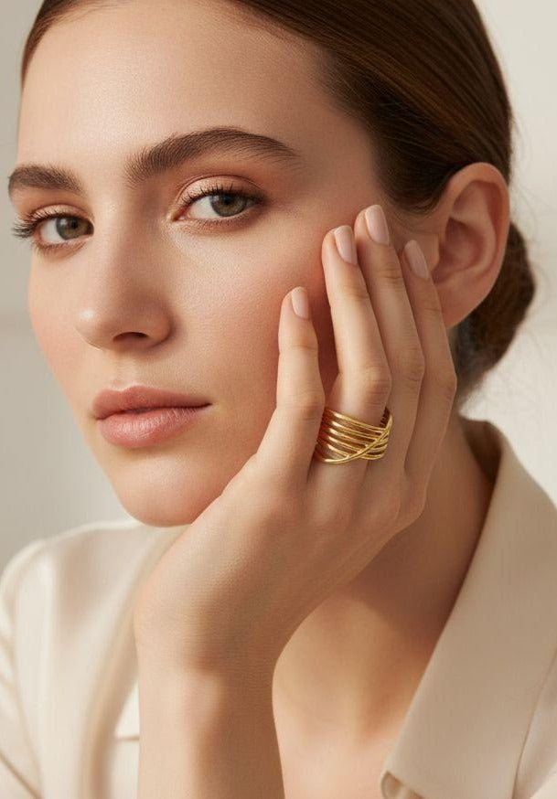 BAGUE EN ACIER DORÉ MOTIF SPIRALE AJOURÉE