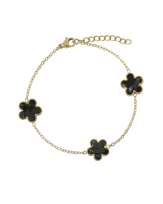 Vergulde stalen armband met onyxkleurige parelmoerbloem