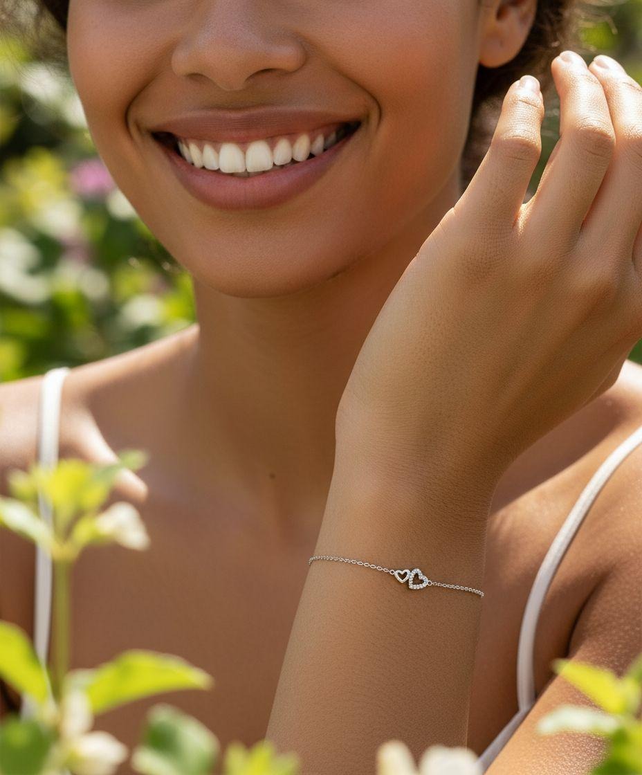 BRACELET EN ARGENT AVEC 2 COEURS ET PIERRES