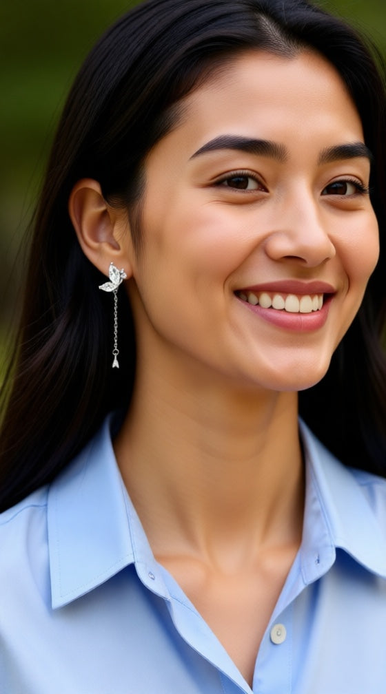 Zilveren oorbellen met vlinder en steentjes