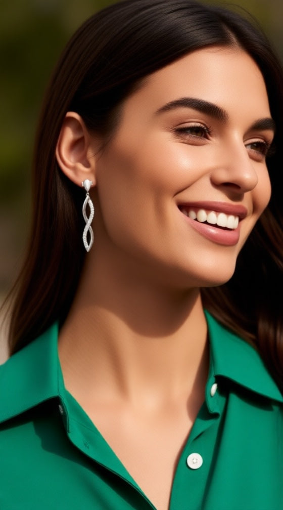 Zilveren Infinity oorbellen met steentjes