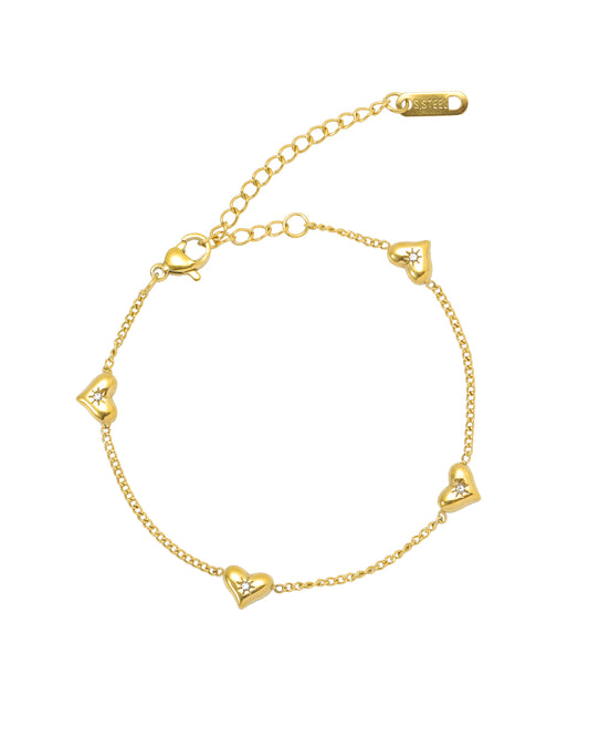 Bracelet en acier doré avec coeurs bombes et strass