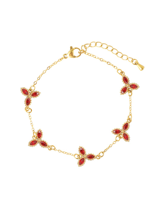 Bracelet en acier doré avec motif floral rubis