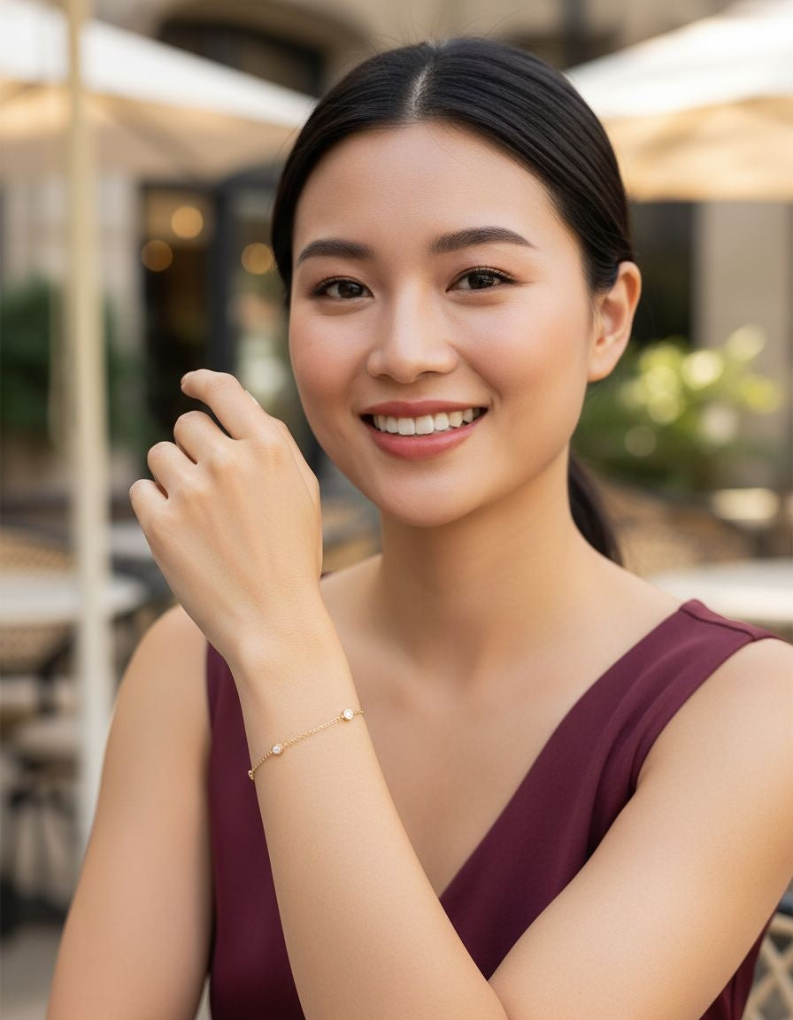 BRACELET EN ACIER DORE AVEC RONDS EN STRASS