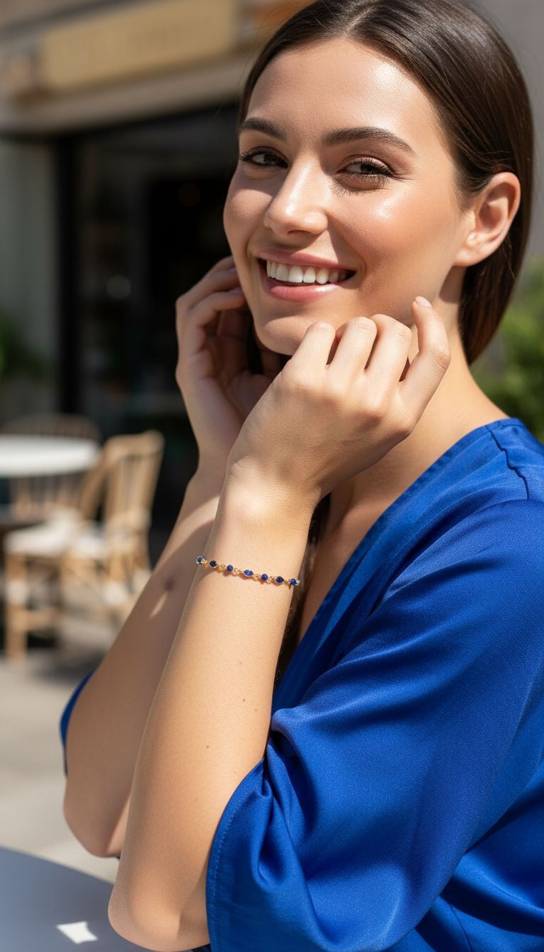 BRACELET EN PLAQUE OR PIERRES ET BILLES BLEUES