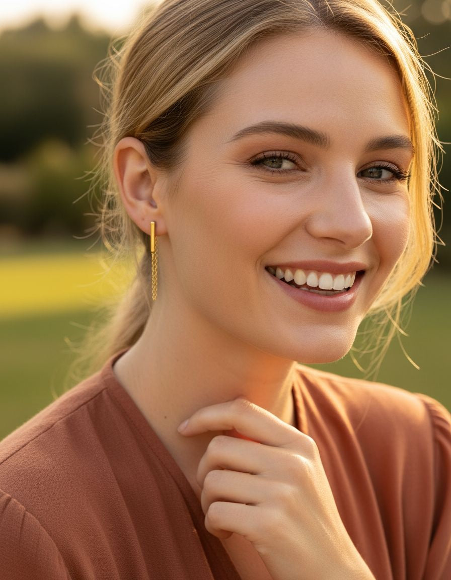 BOUCLES D'OREILLES EN ACIER DORE BARRE ET CHAINE