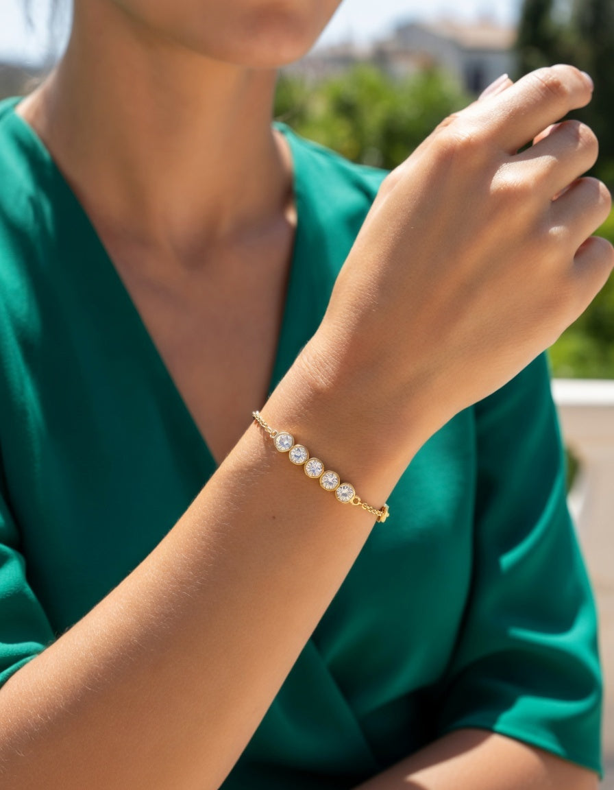 VERGULDE STALEN ARMBAND MET STRASS