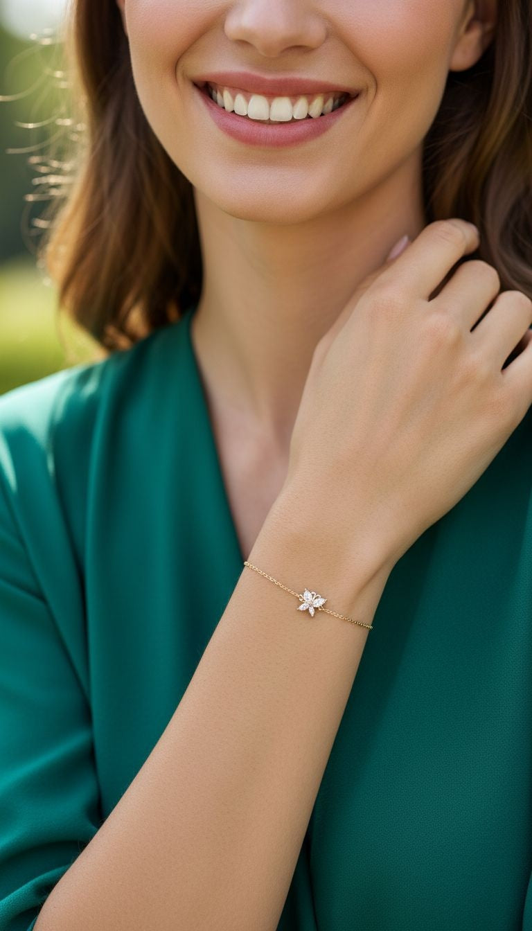 VERGULDE ARMBAND MET ZIRKONIUM VLINDER