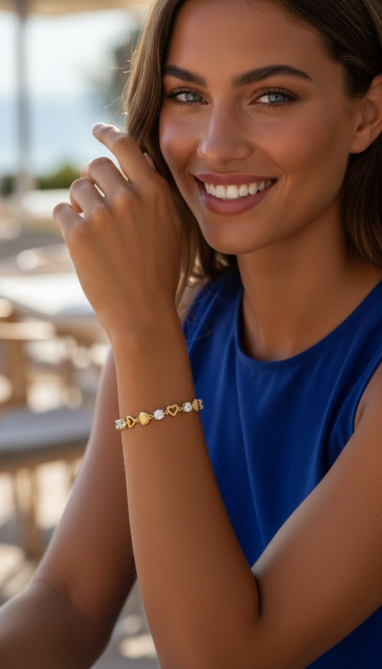 VERGULDE ARMBAND MET HART- EN SCHELPONTWERP EN ZIRKONIUM