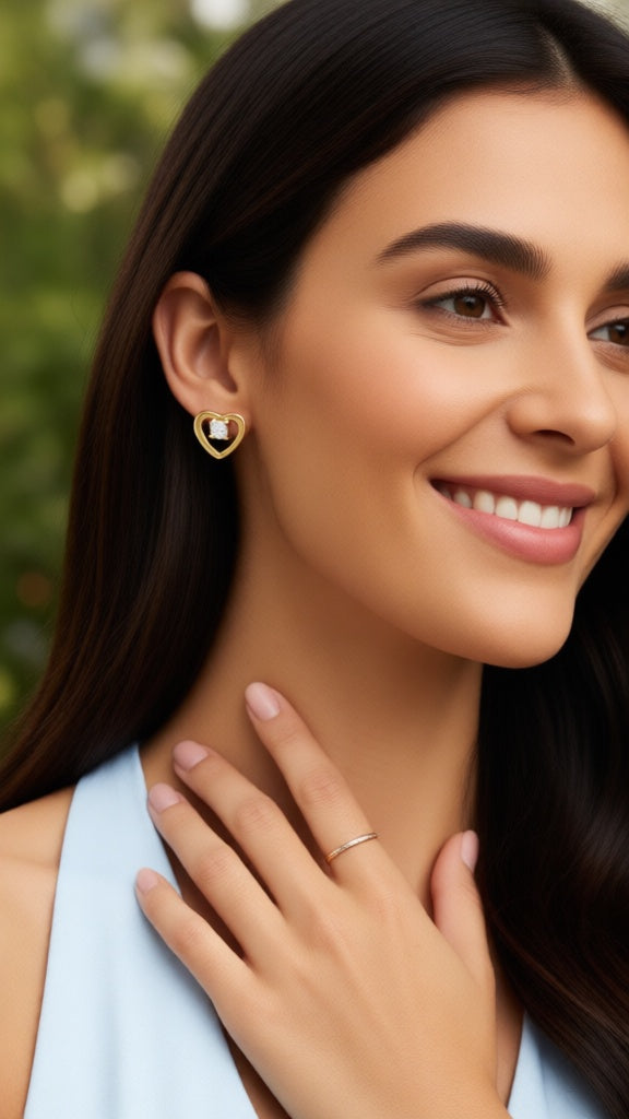 Vergulde oorbellen met hart en steen