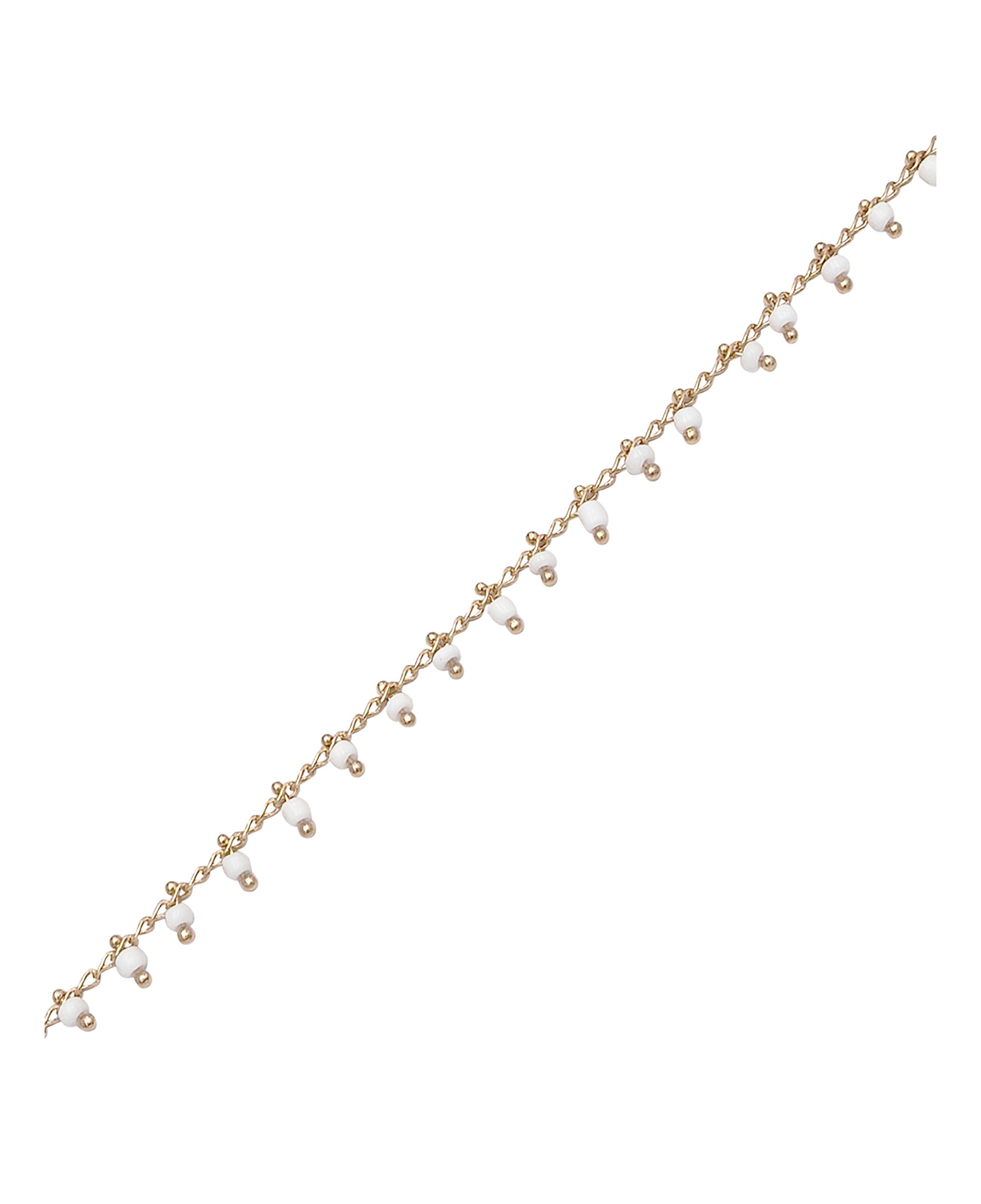 BRACELET EN PLAQUE OR AVEC BILLES BLANCHES PENDANTES