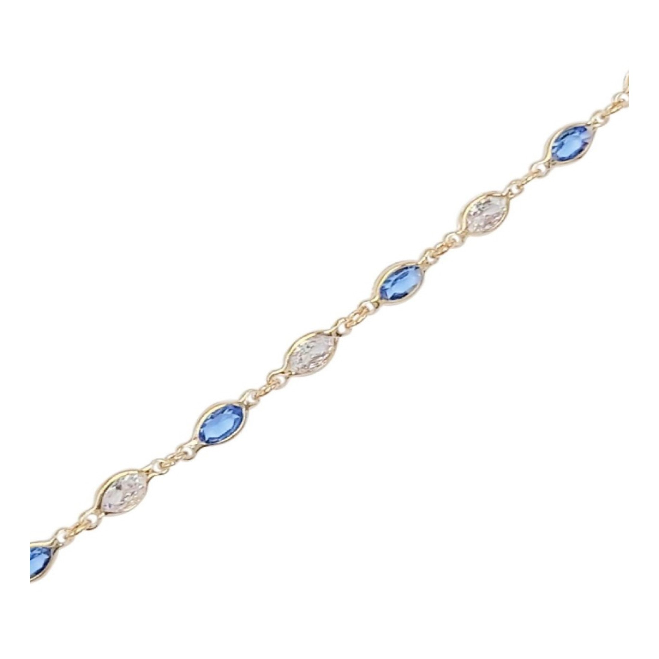 BRACELET EN PLAQUE OR PIERRES BLANCHES ET BLEUES