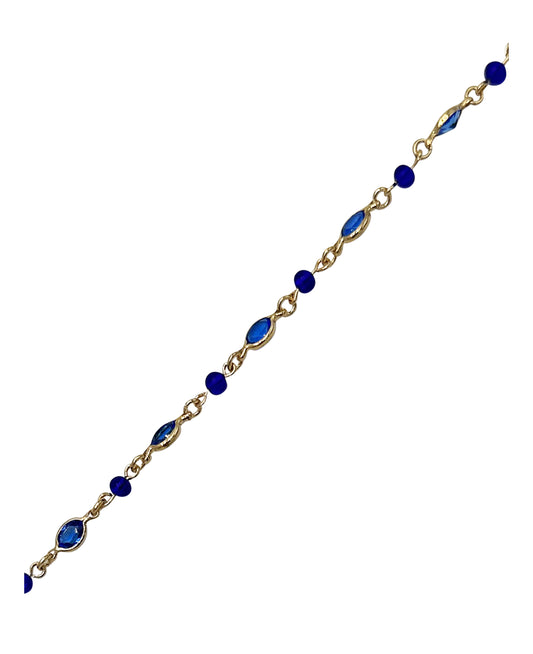 Vergulde armband met blauwe stenen en kralen